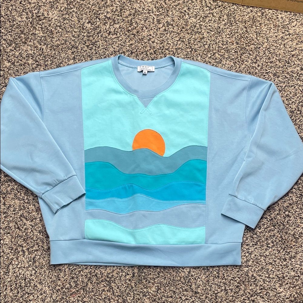 Blue Sweatshirt with Ocean and Sun Design